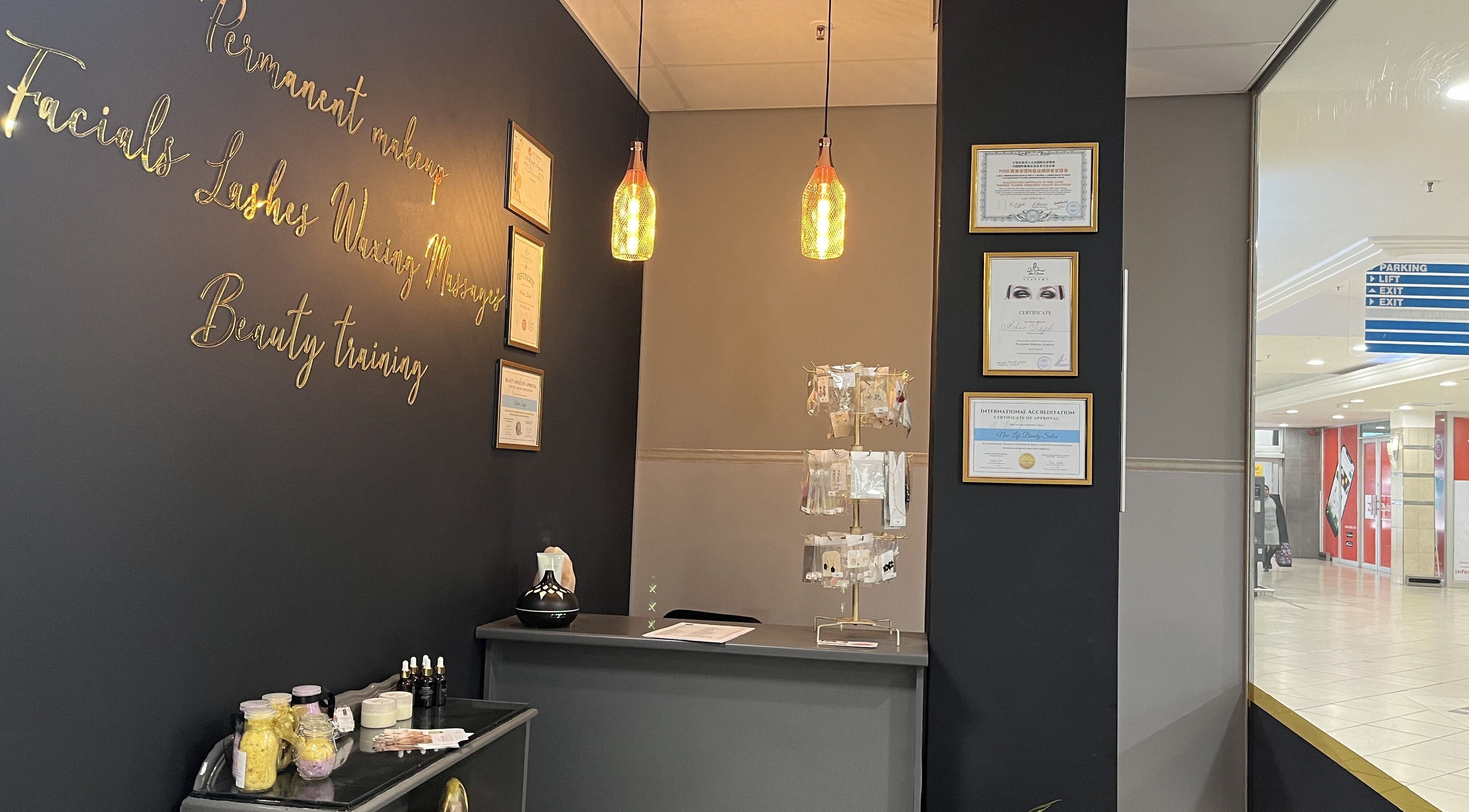 Elegant reception at New Life Beauty and Wellness Killarney, Johannesburg, Gauteng, ZA with certificates and decor.