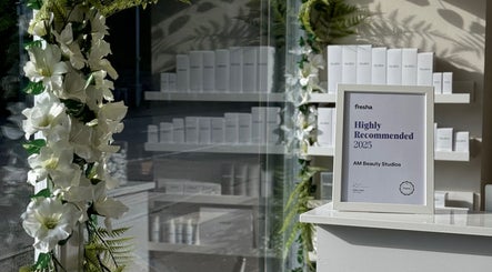 Award frame surrounded by floral decor at AM Beauty Studios - Slateford, Edinburgh, Scotland, GB.