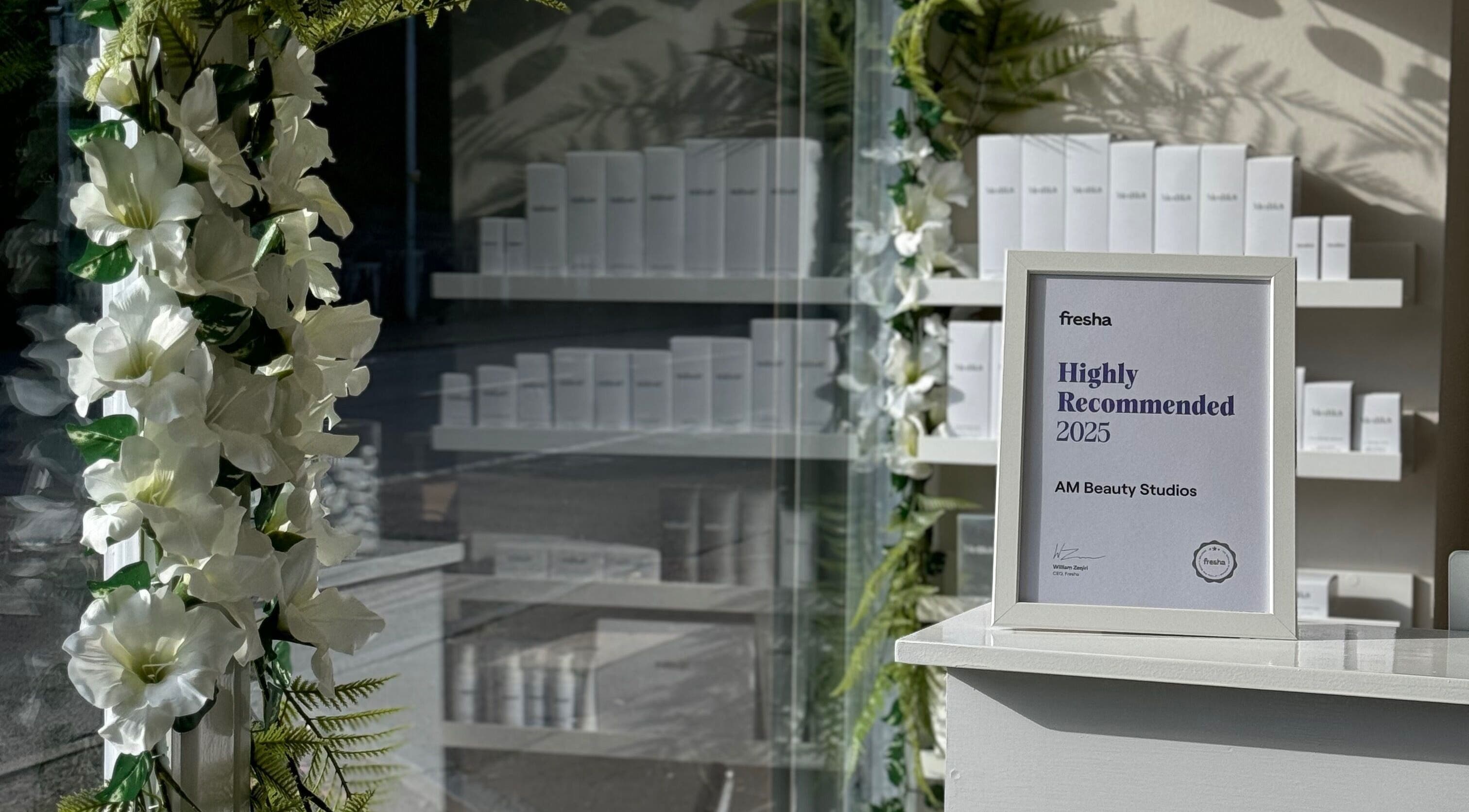 Award frame surrounded by floral decor at AM Beauty Studios - Slateford, Edinburgh, Scotland, GB.