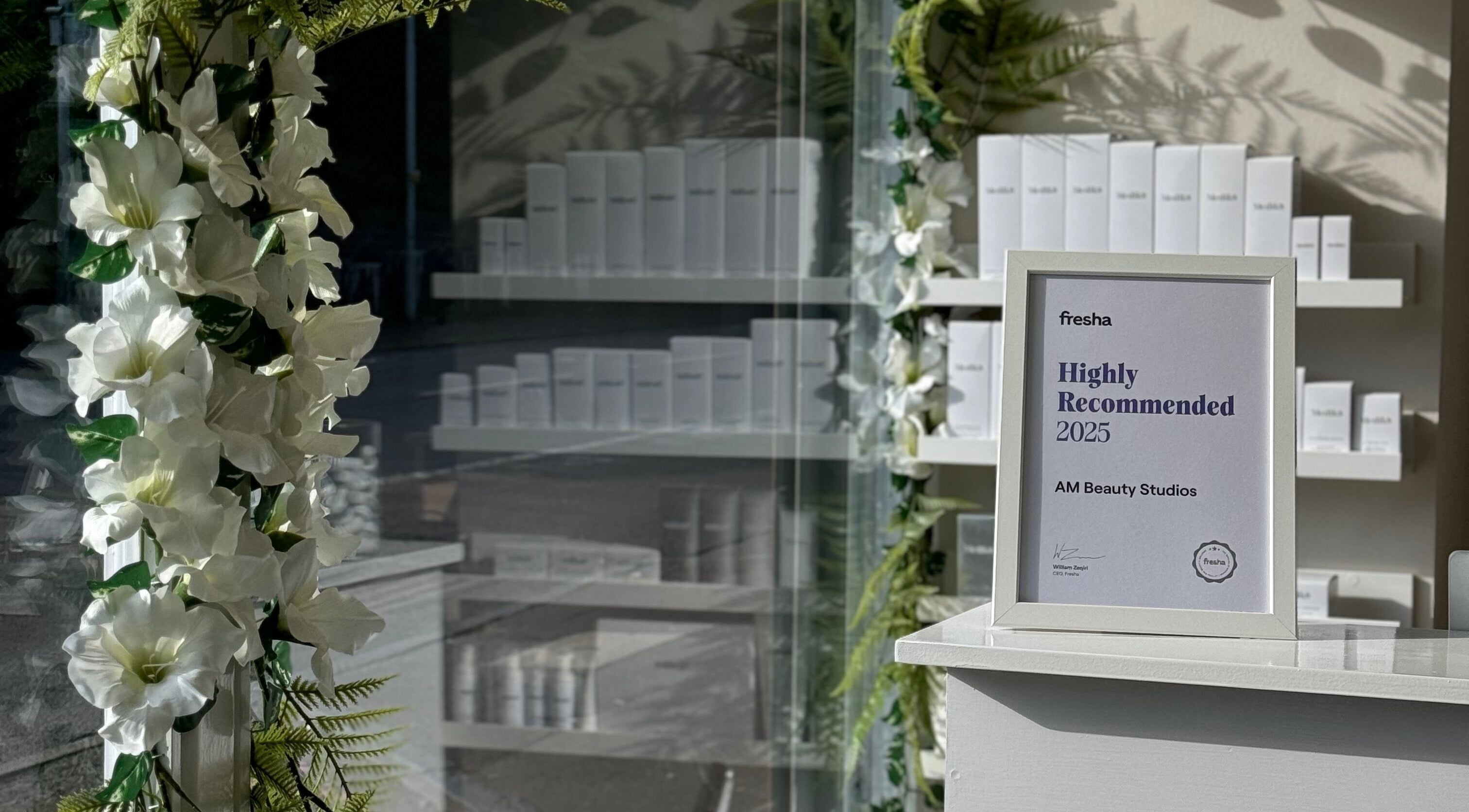 Award frame surrounded by floral decor at AM Beauty Studios - Slateford, Edinburgh, Scotland, GB.