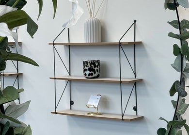 Elegant shelves with decor at AM Beauty Studios Kingsknowe, Edinburgh, Scotland, GB, enhancing the serene ambiance.