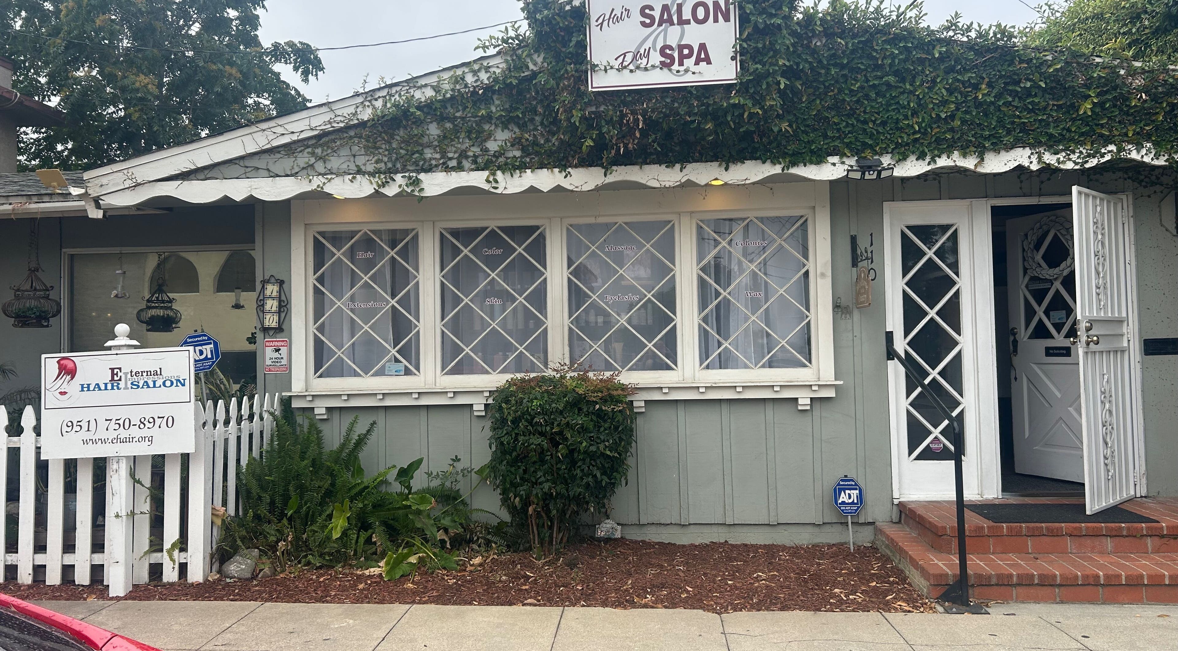 Charming exterior of 807 W Grand Blvd Ste C, a beauty venue in Corona, California, US, adorned with vines.