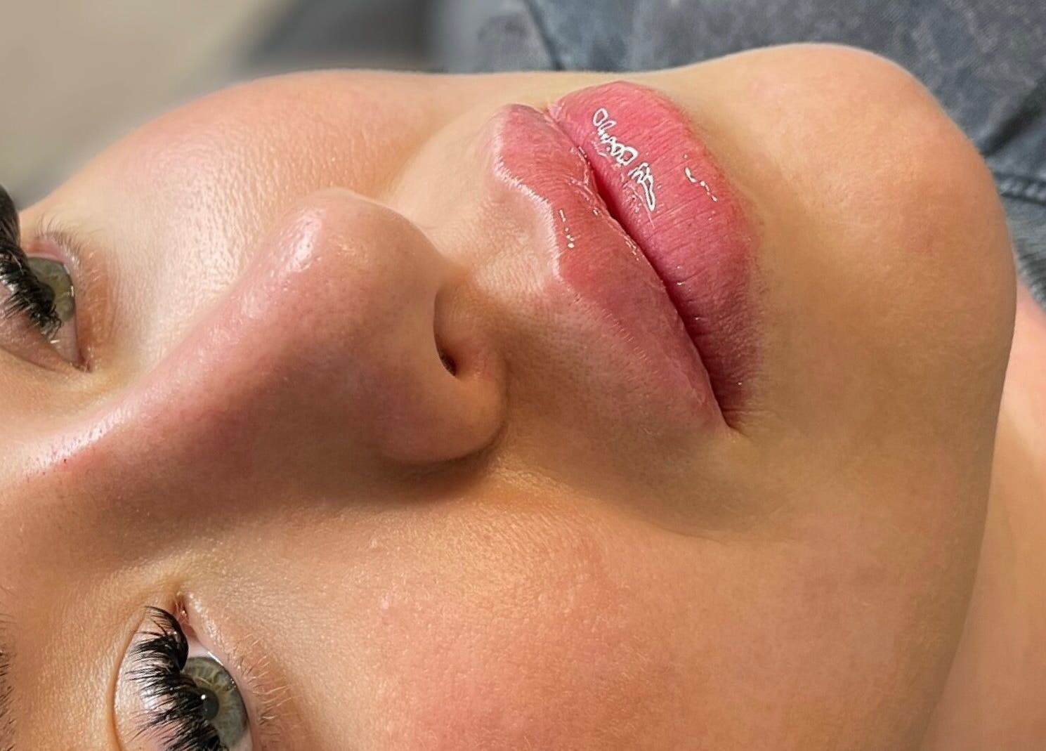 Close-up of glossy lips and lashes at AE Clinics - Abigael Eva, Colchester, England, GB.