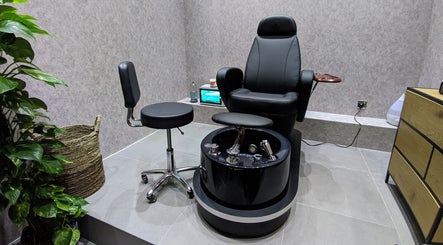 Luxurious pedicure chair at Grow Organic Gents Salon, Dubai, AE with modern interior details.