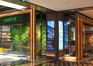 Stylish exterior of Grow Organic Gents Salon with lush greenery in Dubai, AE.