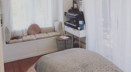 Inviting room at Inside Out Beauty, Waipapa, Northland, NZ with comfy bench and makeup station.