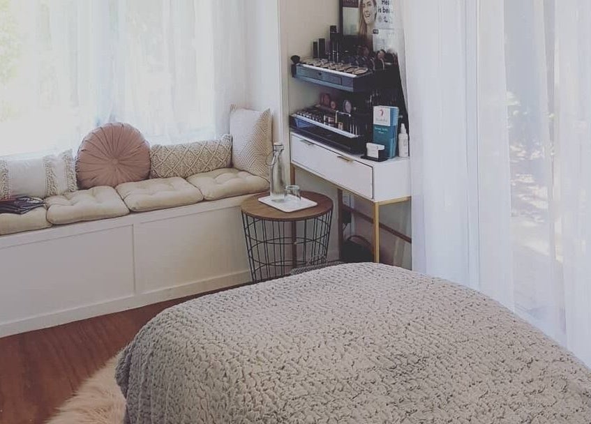 Relaxing spa room at Inside Out Beauty, Waipapa, Northland, NZ with cozy seating and elegant decor.