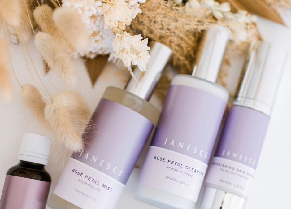 Luxury skincare products at Inside Out Beauty, Waipapa, Northland, NZ, with elegant floral decor.