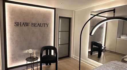 Elegant interior of Lauren Shaw Make Up and Beauty in Sandbach, England, GB with stylish seating and mirror.
