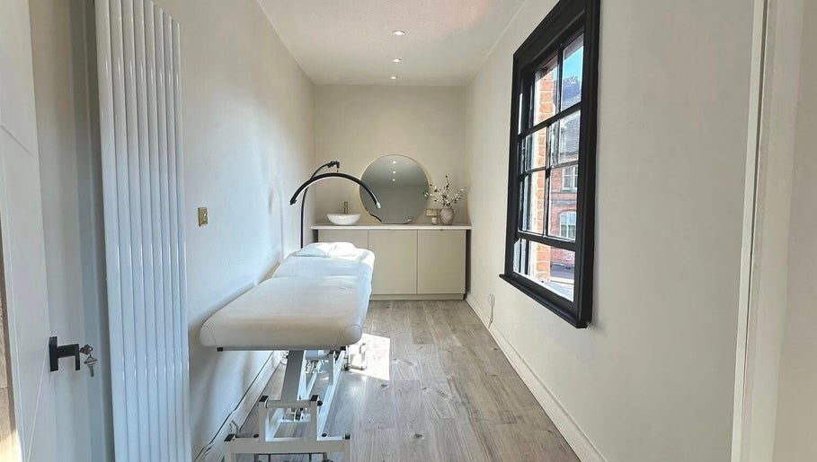 Elegant treatment room at Shaw Beauty, Sandbach, England, GB with a massage table and modern decor.