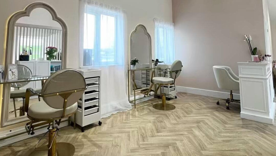 Elegant hair styling station at By Becky Studios, Wells, England, GB, featuring chic mirrors and plush chairs.