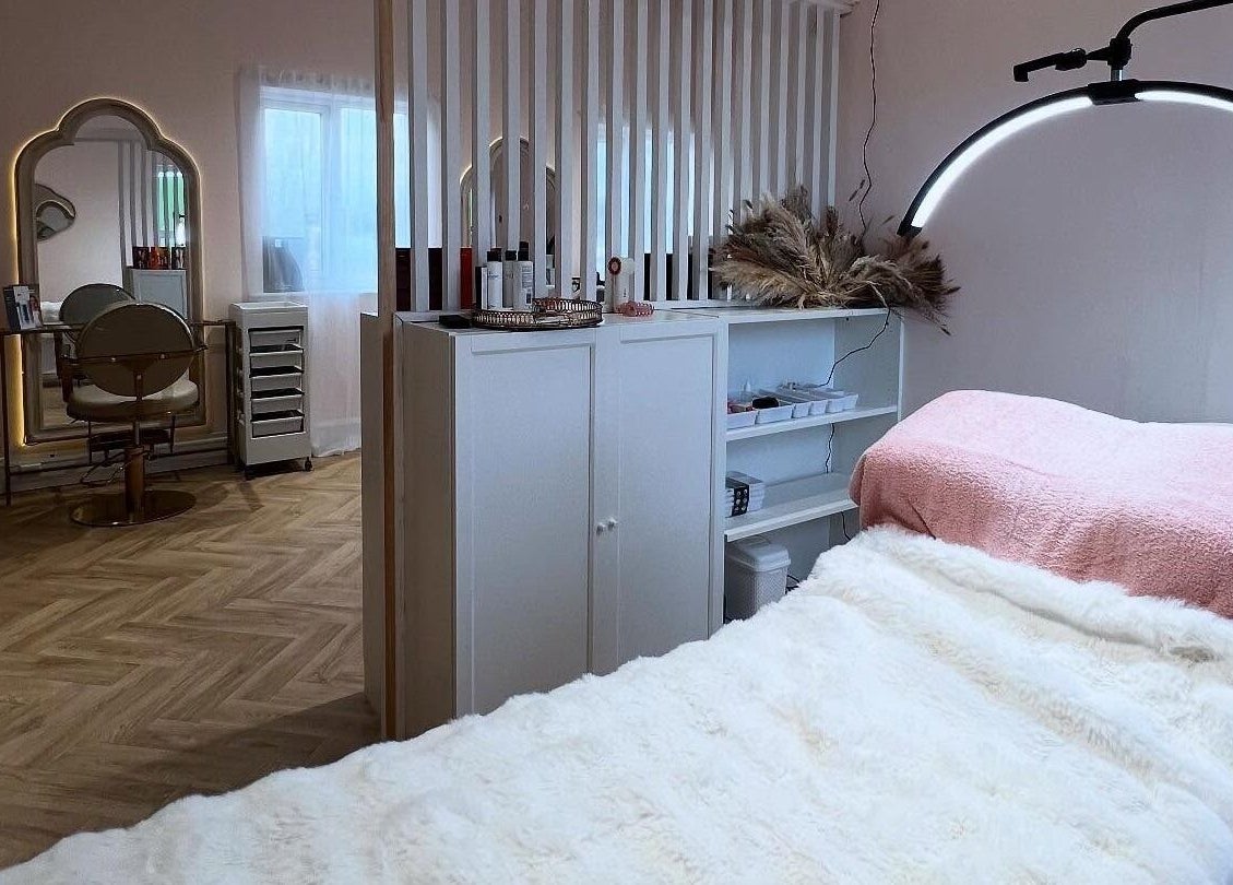 Cozy treatment room at By Becky Studios, Wells, England, GB with plush bed and elegant decor.