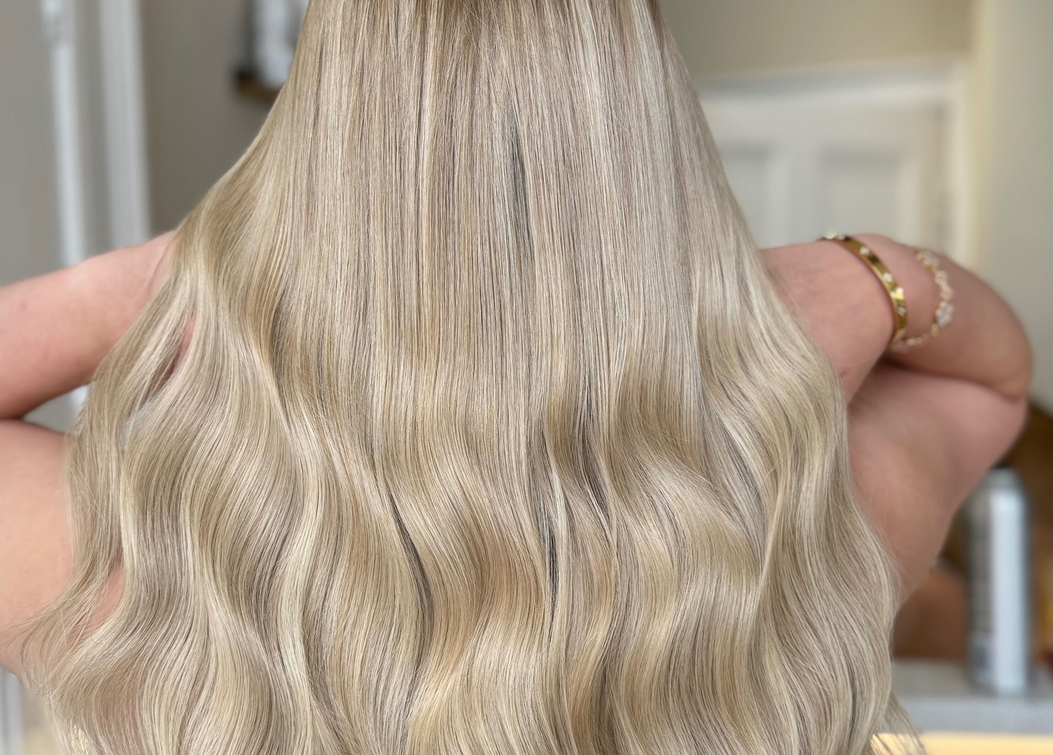 Long, blonde wavy hair styled at The Salon | Meg & Mabel in Hereford, England, GB.