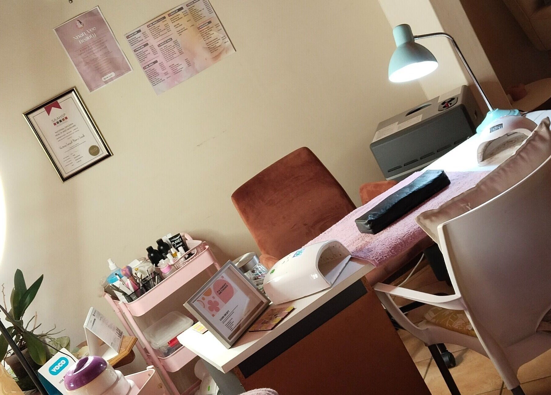 Nnah_Vee Beauty salon workspace in Kimberley, Northern Cape, ZA with professional nail tools and lighting.