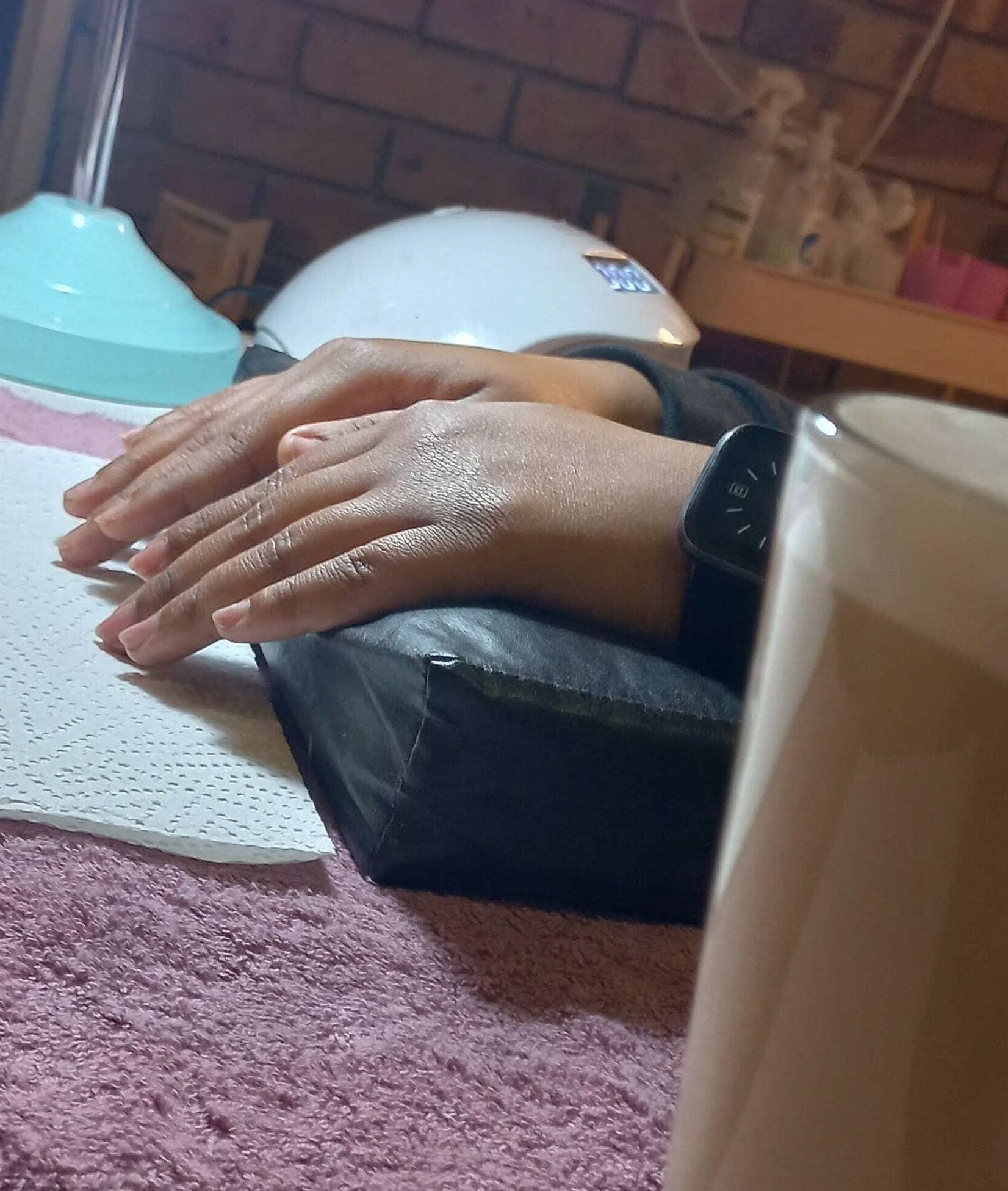 Cozy manicure setup at Nnah_Vee Beauty, Kimberley, Northern Cape, ZA with coffee and tools.