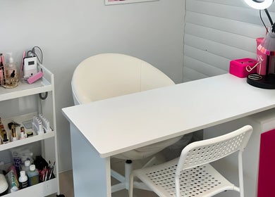Modern beauty station at Lulah Lashes & Beauty, Blyth, England, GB, featuring a sleek white desk and chair.