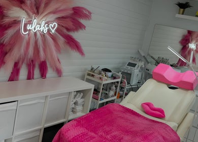 Relaxing beauty room at Lulah Lashes & Beauty, Blyth, England with pink decor and modern equipment.