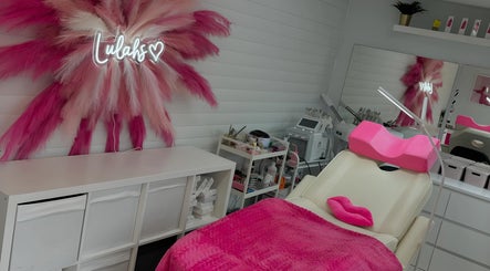 Relaxing beauty room at Lulah Lashes & Beauty, Blyth, England with pink decor and modern equipment.