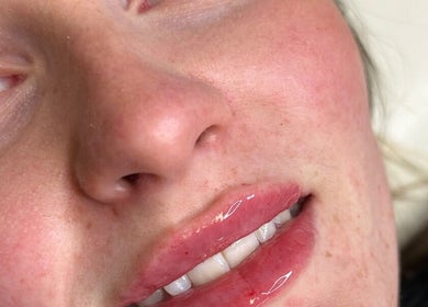 Close-up of glossy lips and lashes at Lulah Lashes & Beauty in Blyth, England, GB.