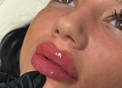 Close-up of glossy lips during beauty treatment at Lulah Lashes & Beauty, Blyth, England, GB.