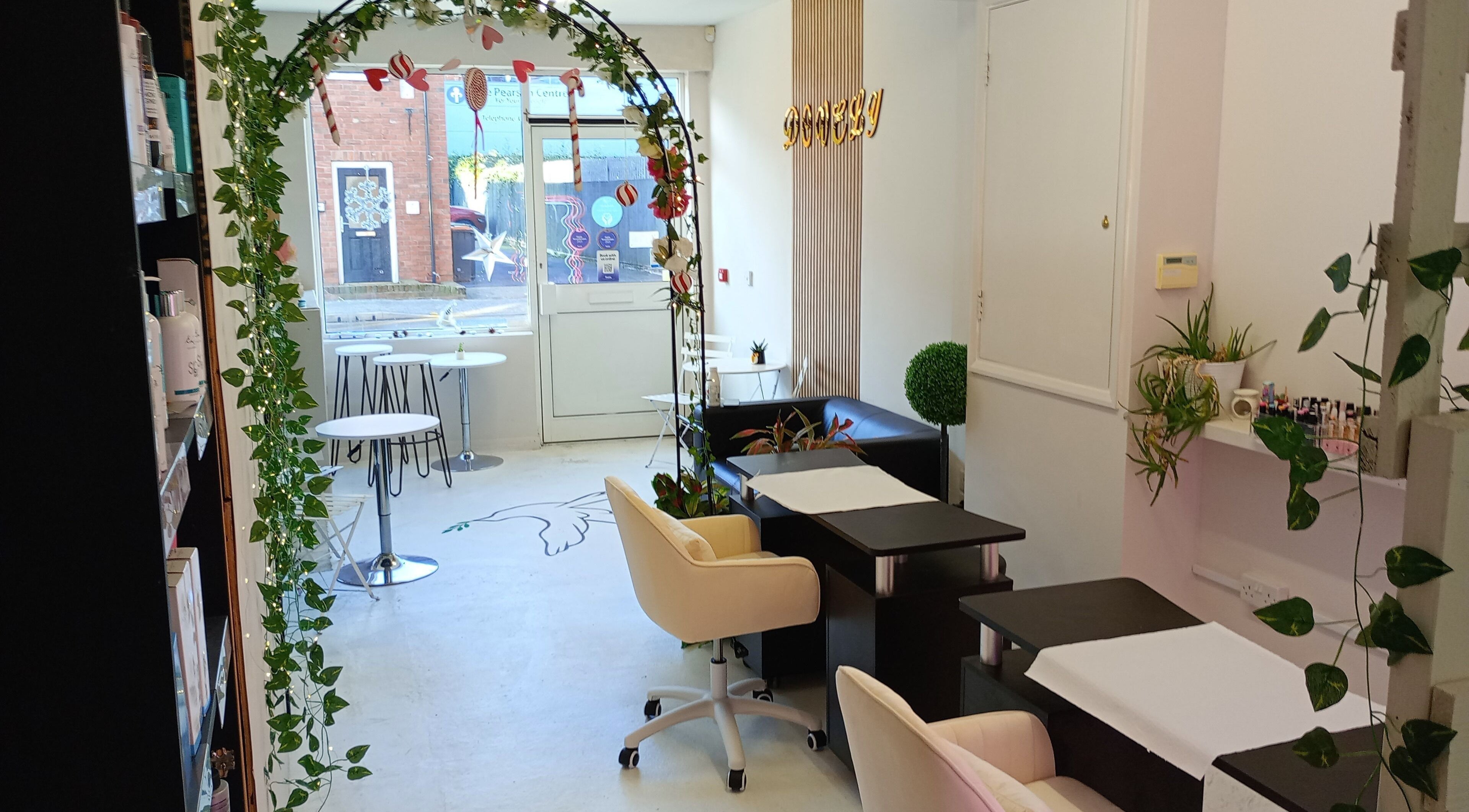 Chic interior of Dovely Limited Book At Dovelybeauty salon in Beeston, England, GB with elegant seating and decor.