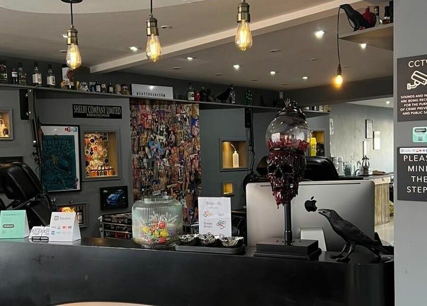 Reception at Black Heart Ink, Swindon, England, GB showcasing eclectic decor and vivid artwork displays.