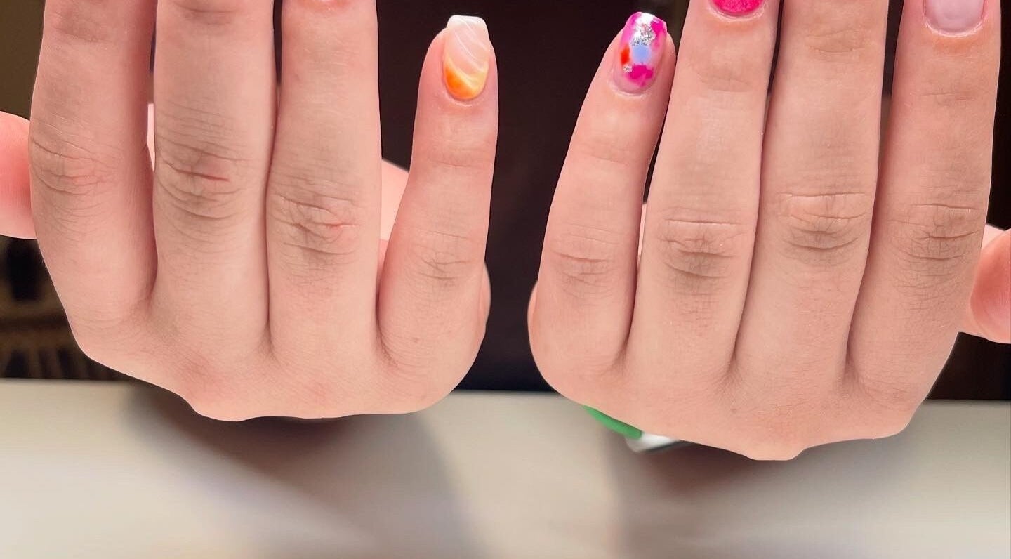Colorful nail art at Nails By Elli in Bryan, Ohio, US showcasing vibrant design and creativity.