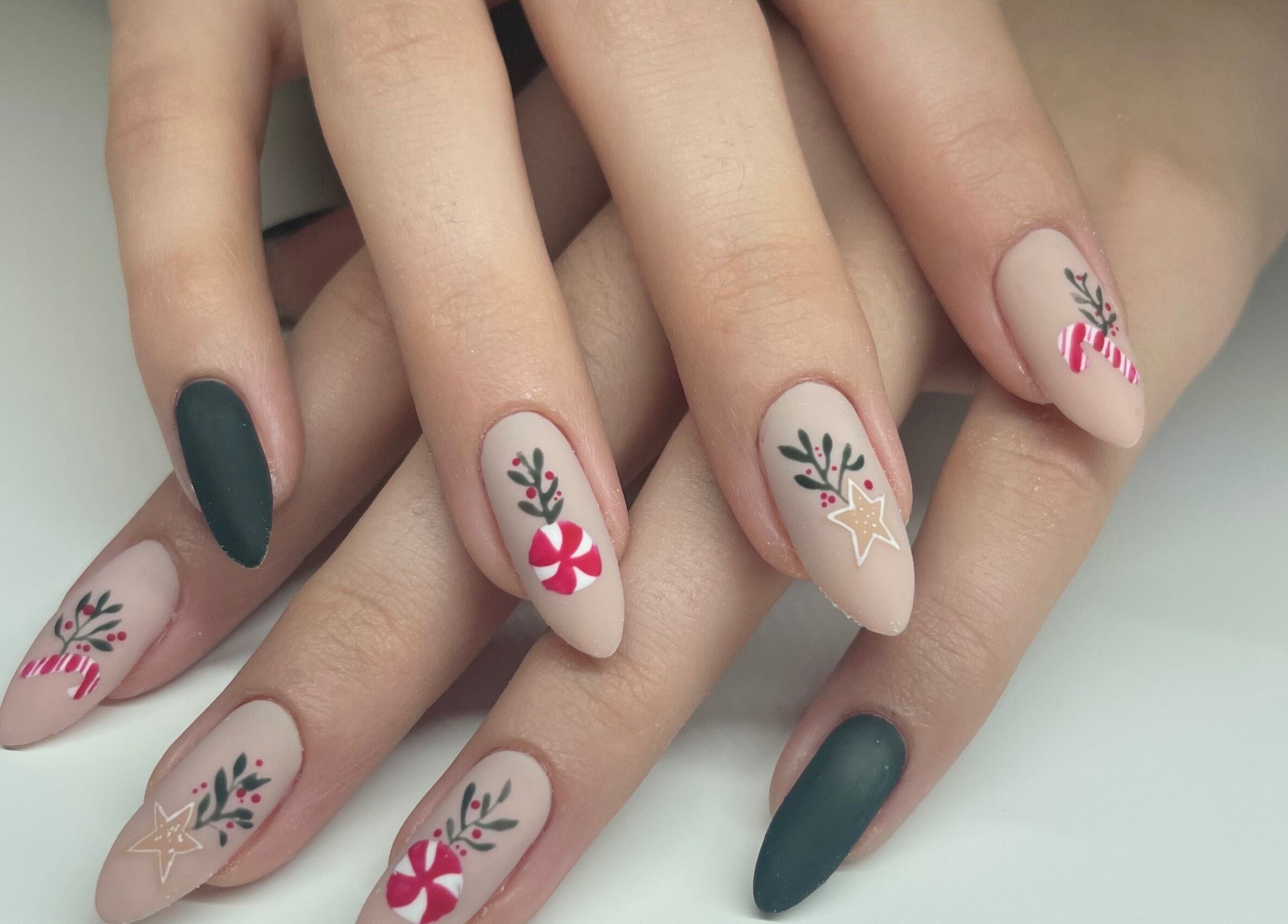 Holiday-themed nail art at Nails By Elli, Bryan, Ohio, US showcasing intricate seasonal designs.