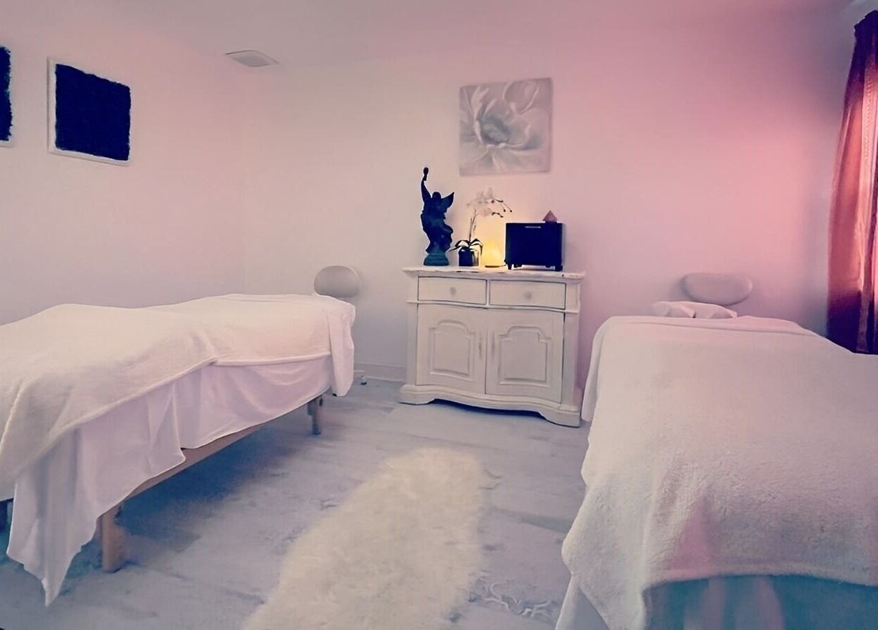 Cozy treatment room at Puritie Spa & Studios, Lahaska - New Hope, Pennsylvania, US with two massage tables.