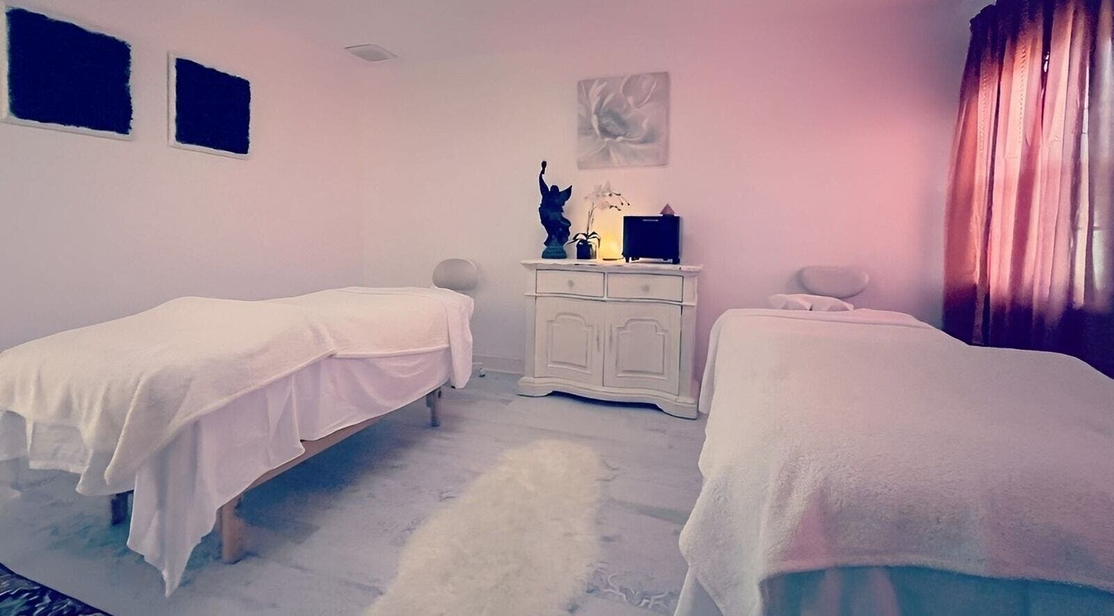 Cozy treatment room at Puritie Spa & Studios, Lahaska - New Hope, Pennsylvania, US with two massage tables.