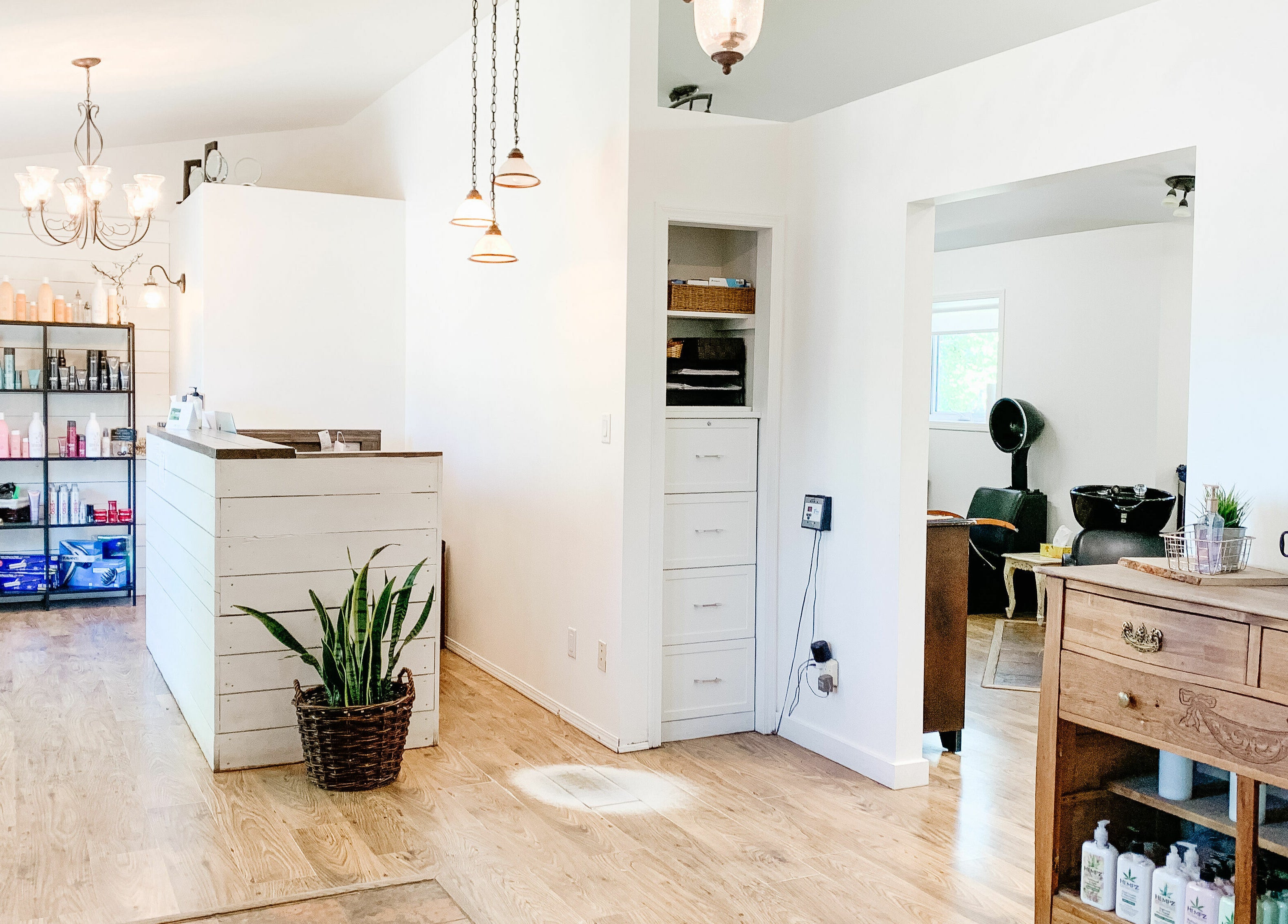 Bright chic interior of Classic Impressions Salon in Grunthal, Manitoba, CA, showcasing reception and waiting area.
