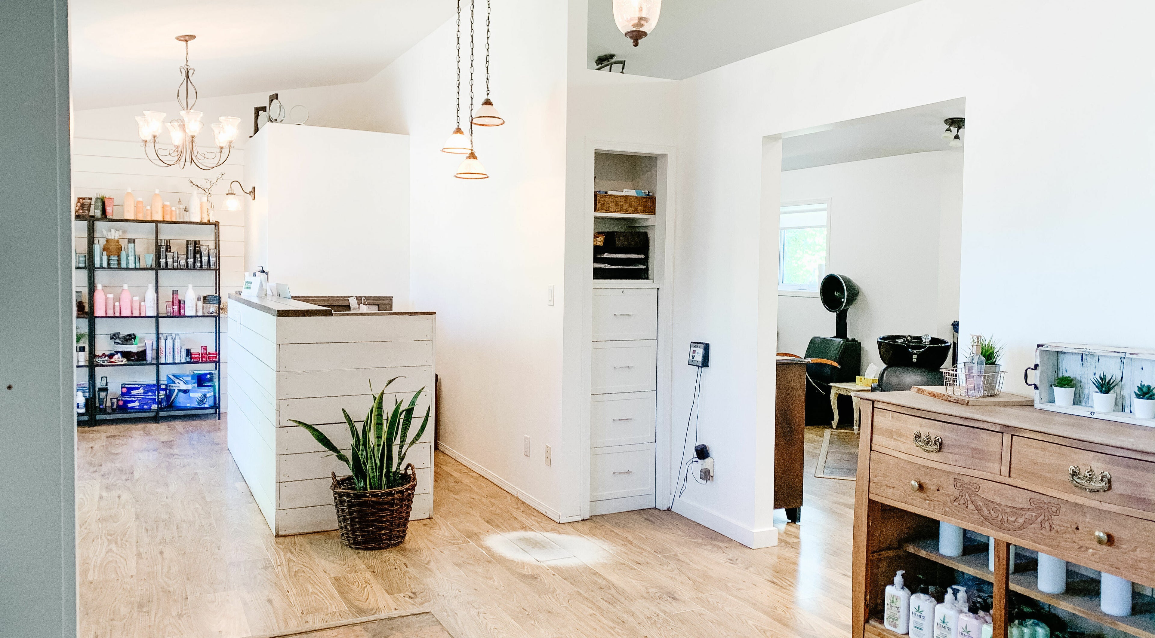 Bright chic interior of Classic Impressions Salon in Grunthal, Manitoba, CA, showcasing reception and waiting area.