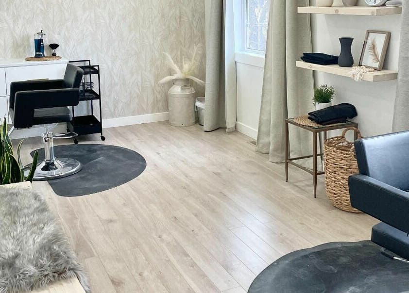 Elegant salon interior at Classic Impressions Salon, Grunthal, Manitoba, CA, featuring modern decor and styling chair.