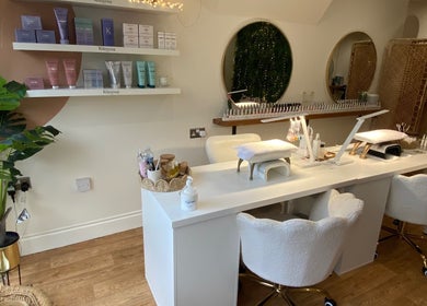 Cozy manicure station at Millie Manicurist in Heage, England, GB showcasing elegant decor and nail care products.