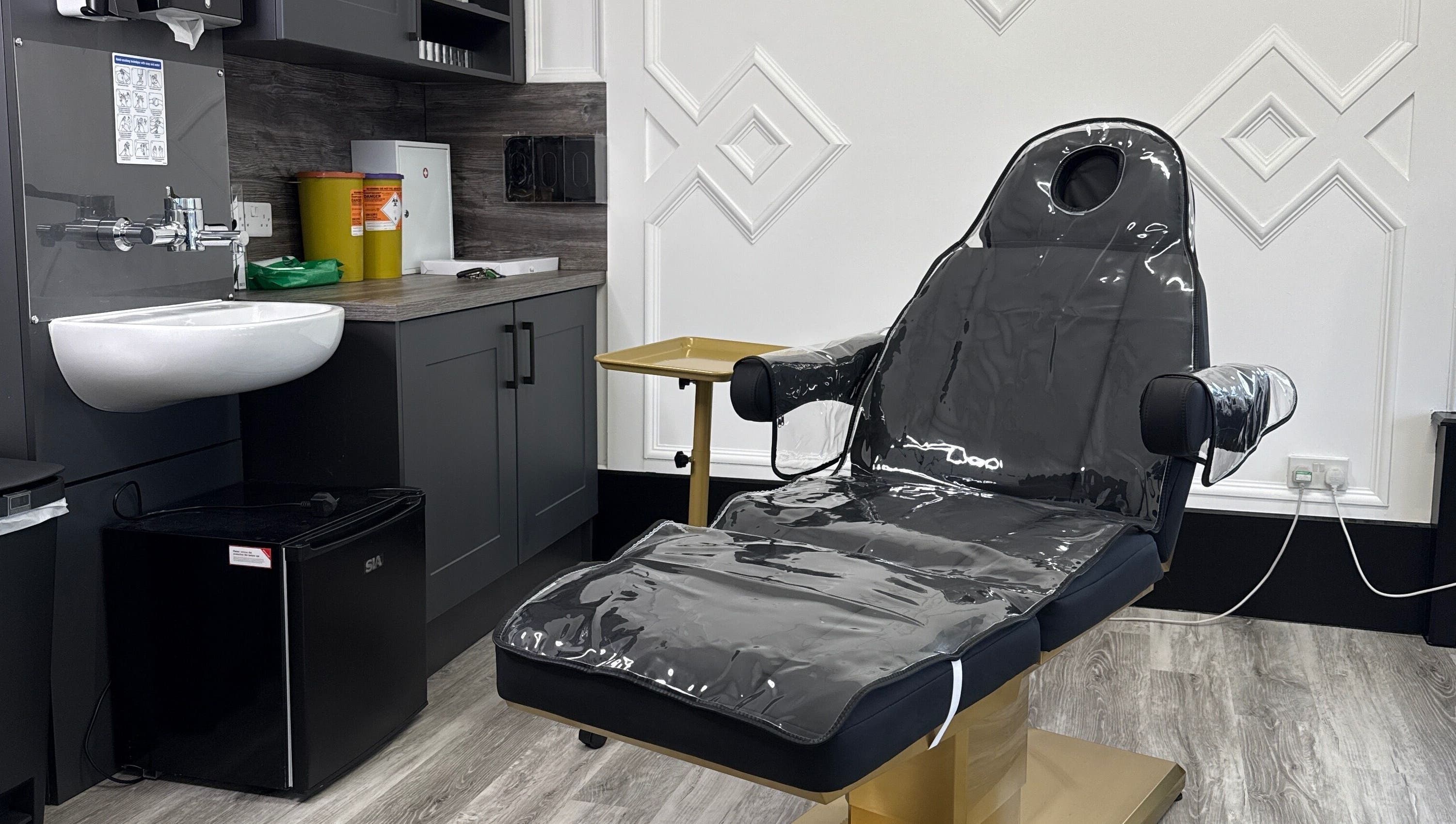 Modern treatment room at ASTHTX Clinic in Motherwell, Scotland, GB with sleek furnishings and a comfortable chair.