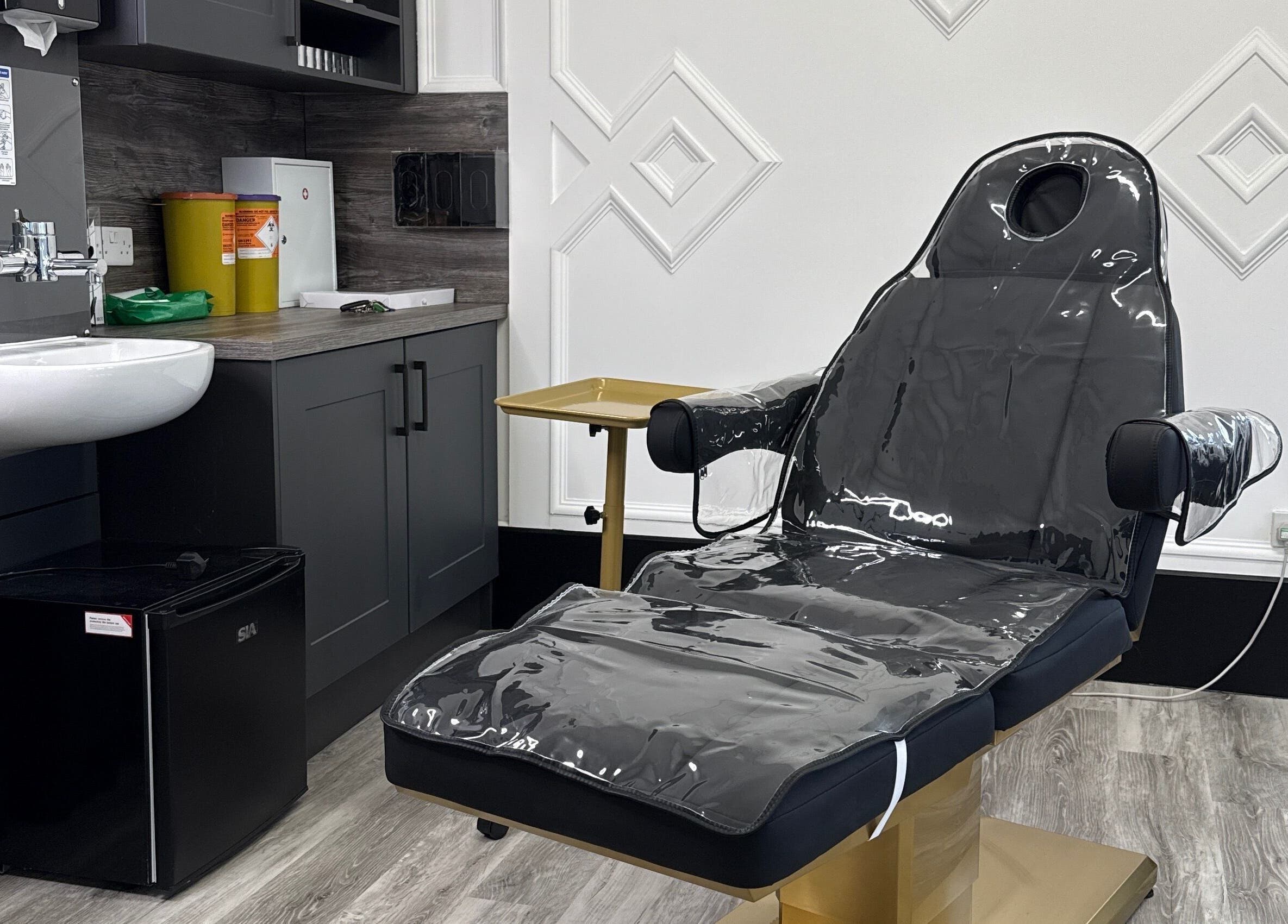 Modern treatment room at ASTHTX Clinic in Motherwell, Scotland, GB with sleek furnishings and a comfortable chair.