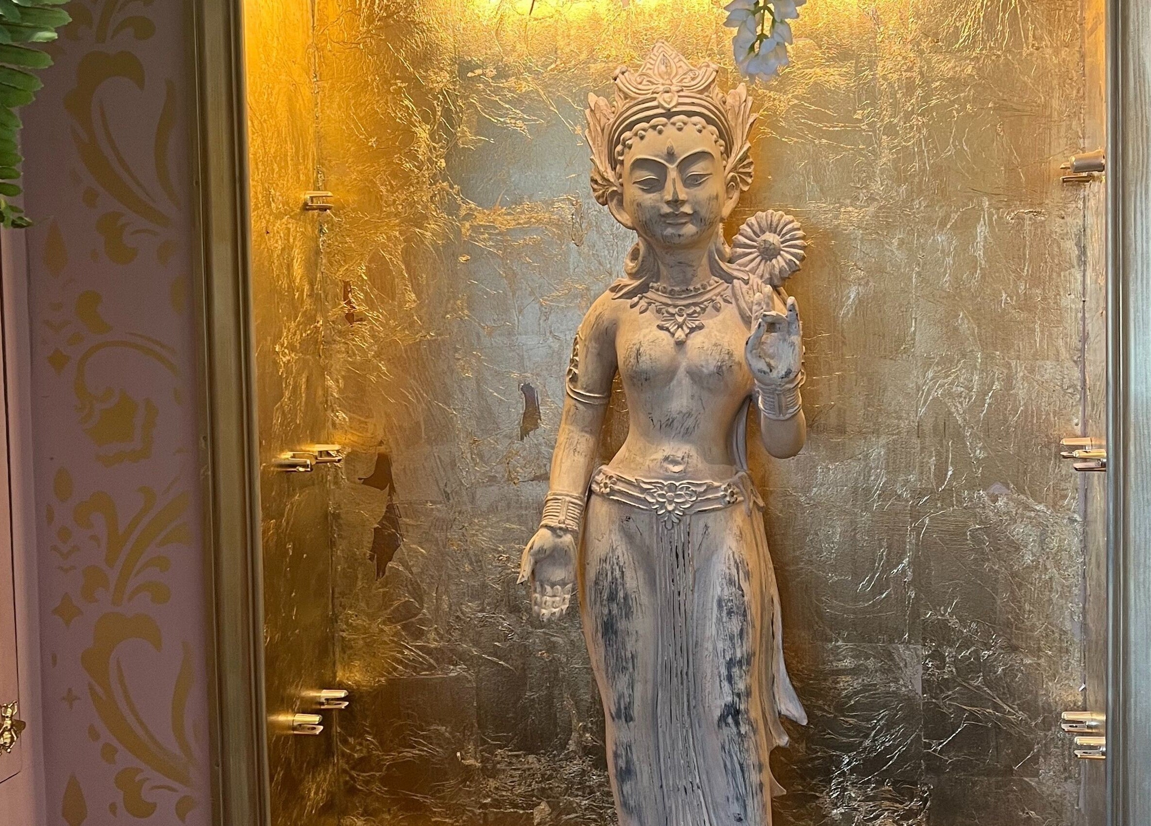 Ornate statue in a golden alcove at Halo, Newcastle-under-Lyme, England, GB.