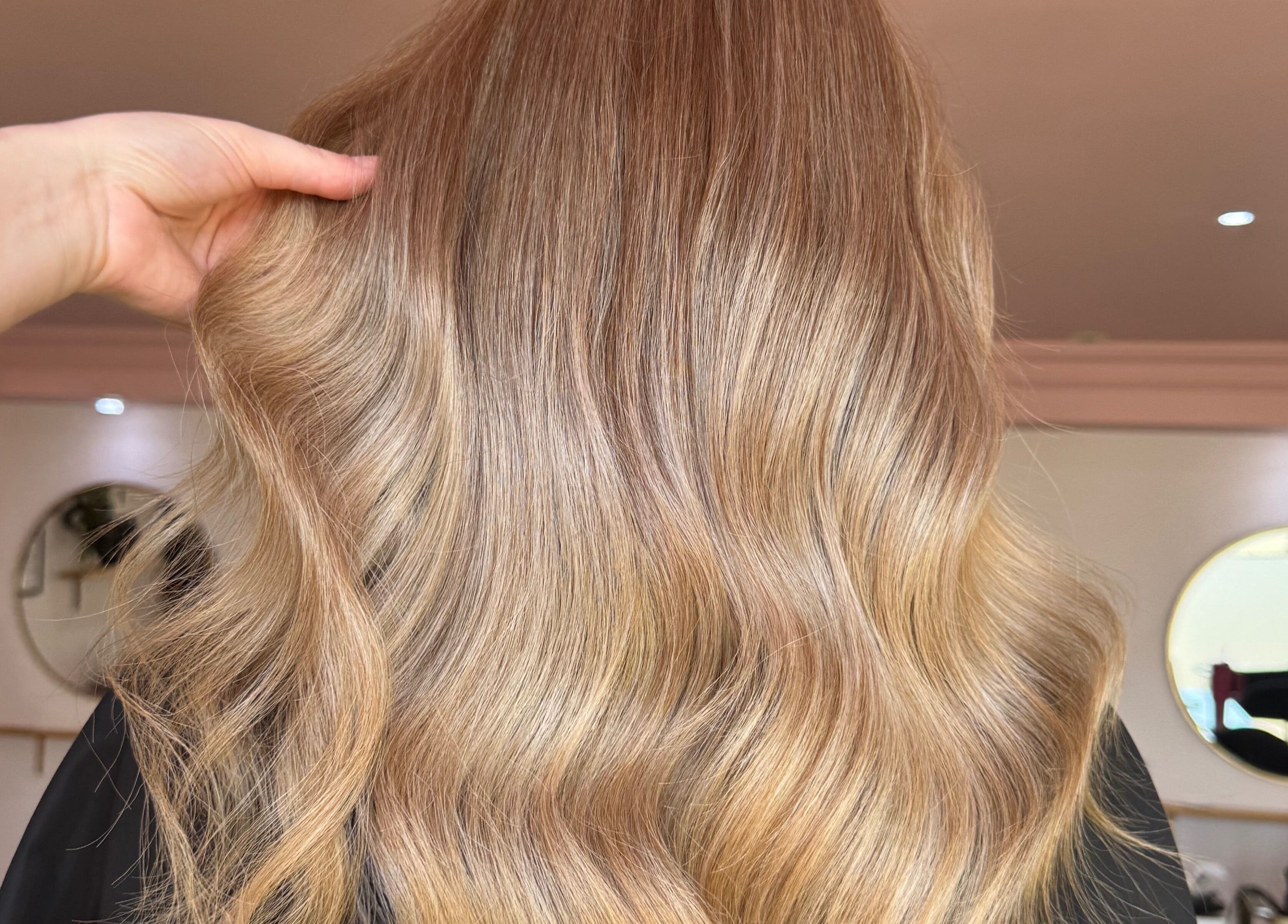 Elegant golden waves styled at Hair By Ellie June in Sawtry, England, GB, reflecting luxurious salon expertise.