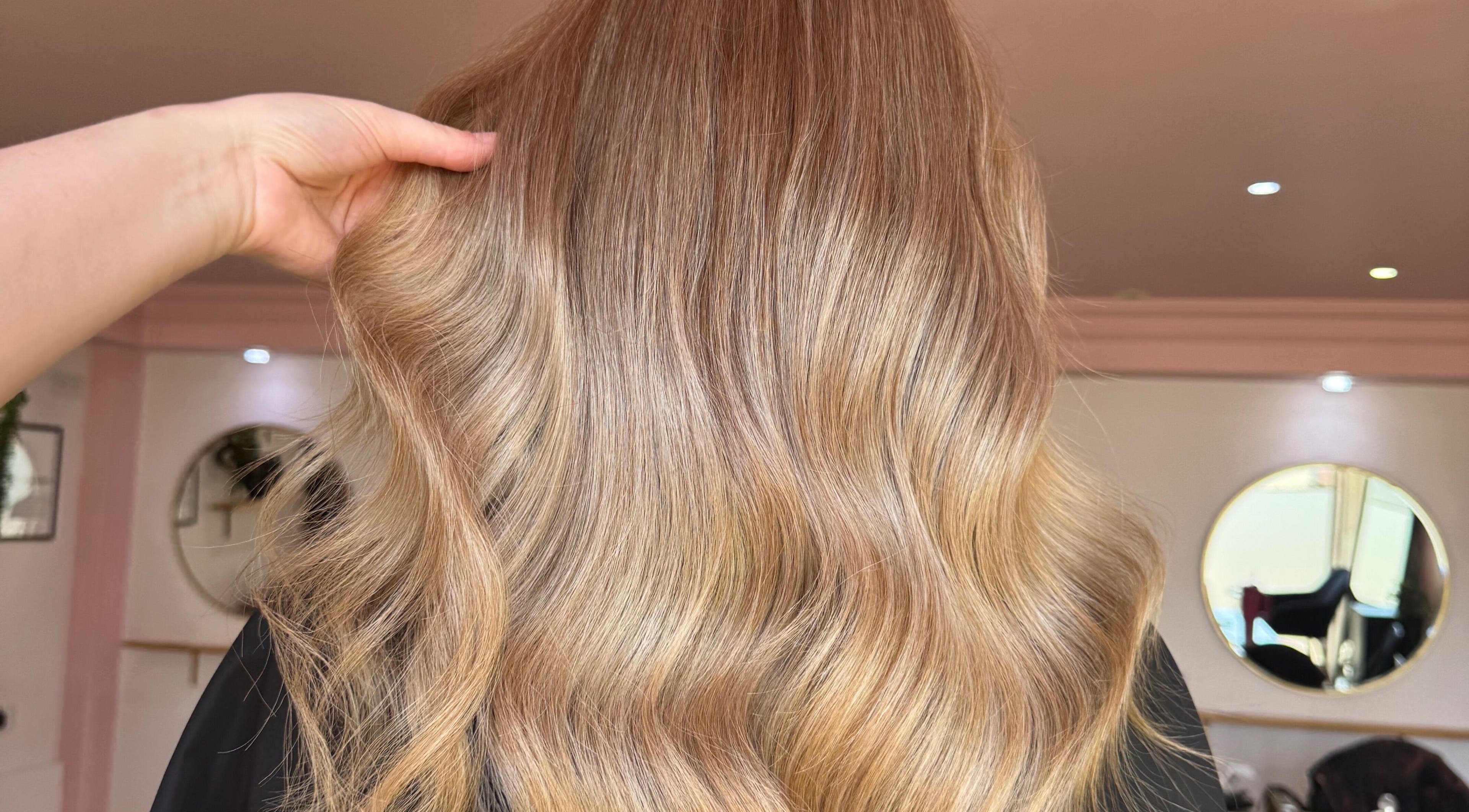 Elegant golden waves styled at Hair By Ellie June in Sawtry, England, GB, reflecting luxurious salon expertise.