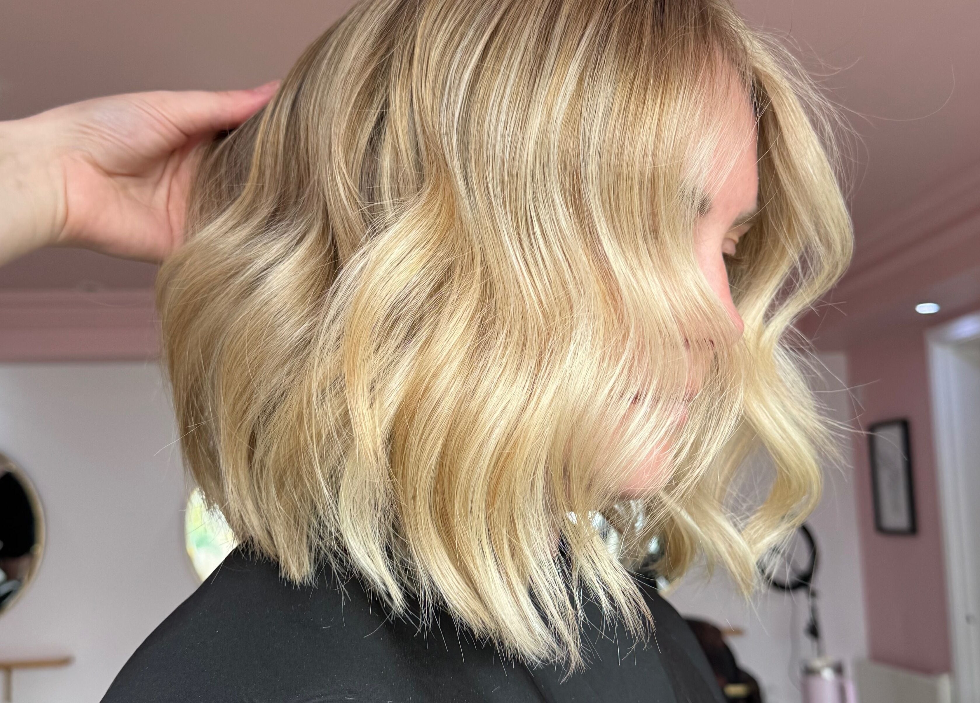 A stylish blonde wavy bob hairstyle at Hair By Ellie June, Sawtry, England, GB salon.