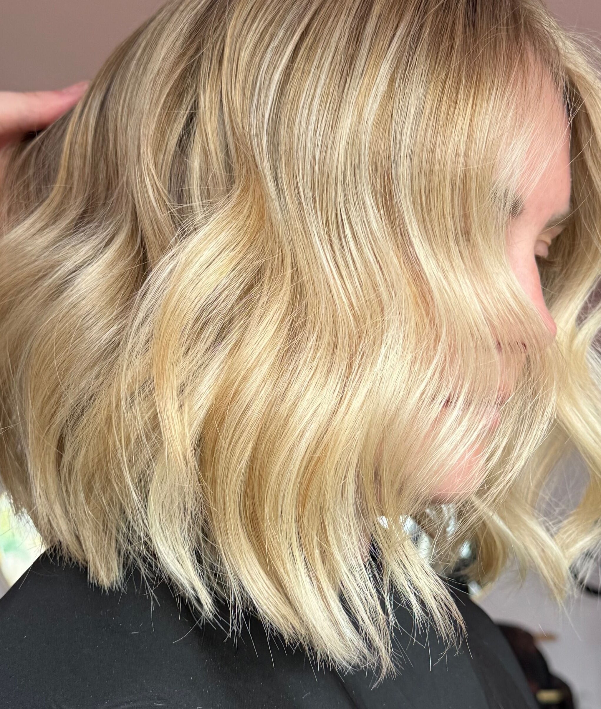 A stylish blonde wavy bob hairstyle at Hair By Ellie June, Sawtry, England, GB salon.
