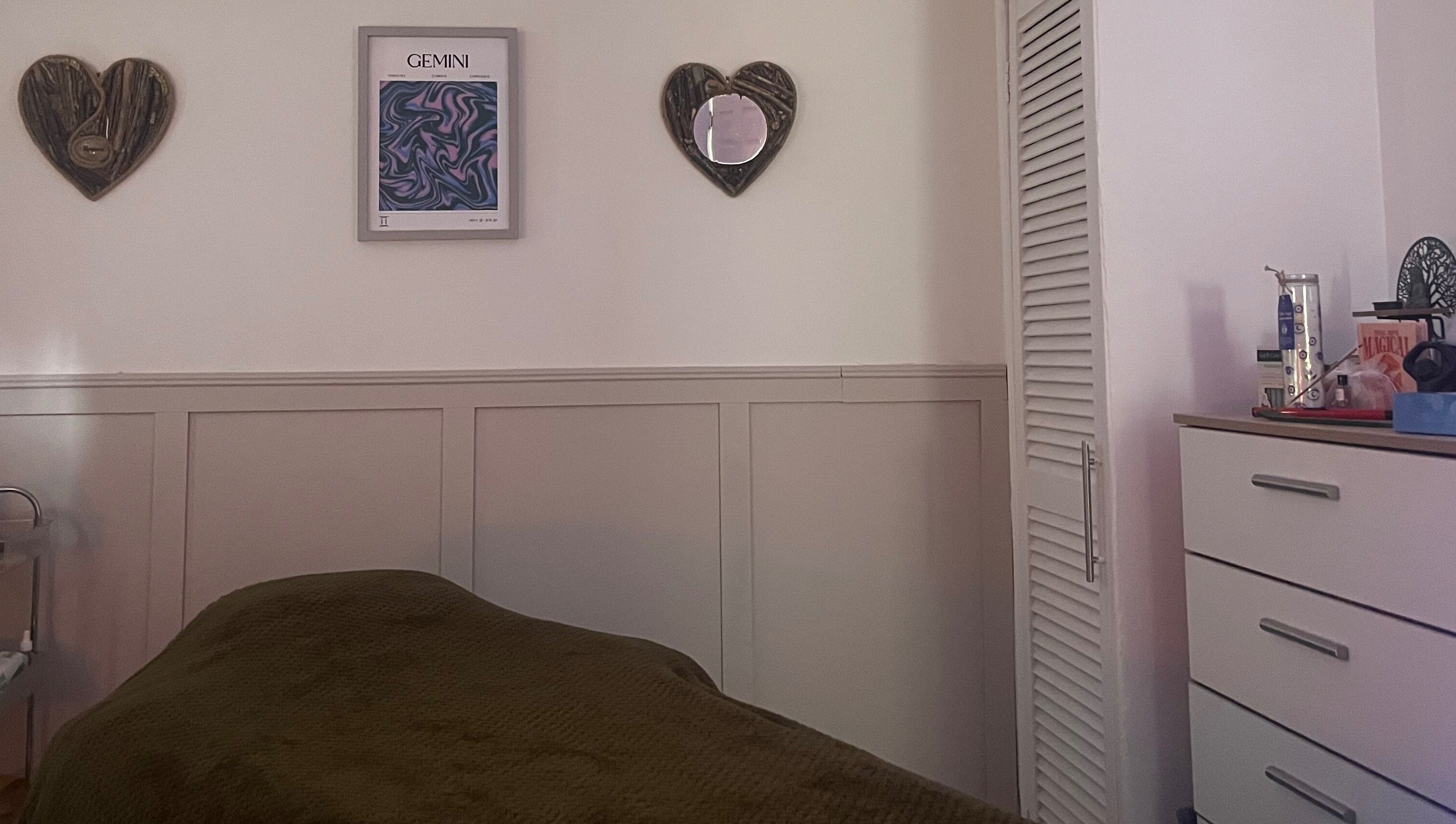 Cozy treatment room at Train Your Spirit, Wishaw, Scotland, GB with calming decor and comfortable massage table.