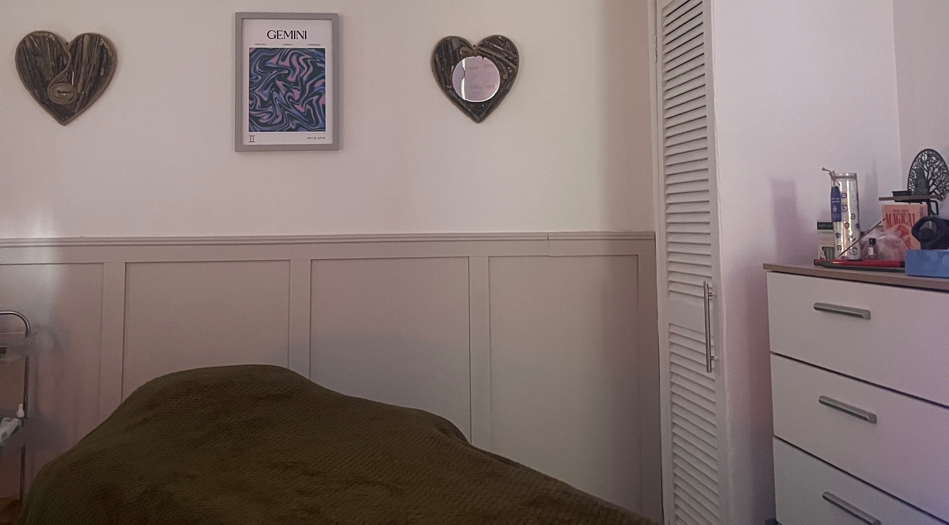 Cozy treatment room at Train Your Spirit, Wishaw, Scotland, GB with calming decor and comfortable massage table.