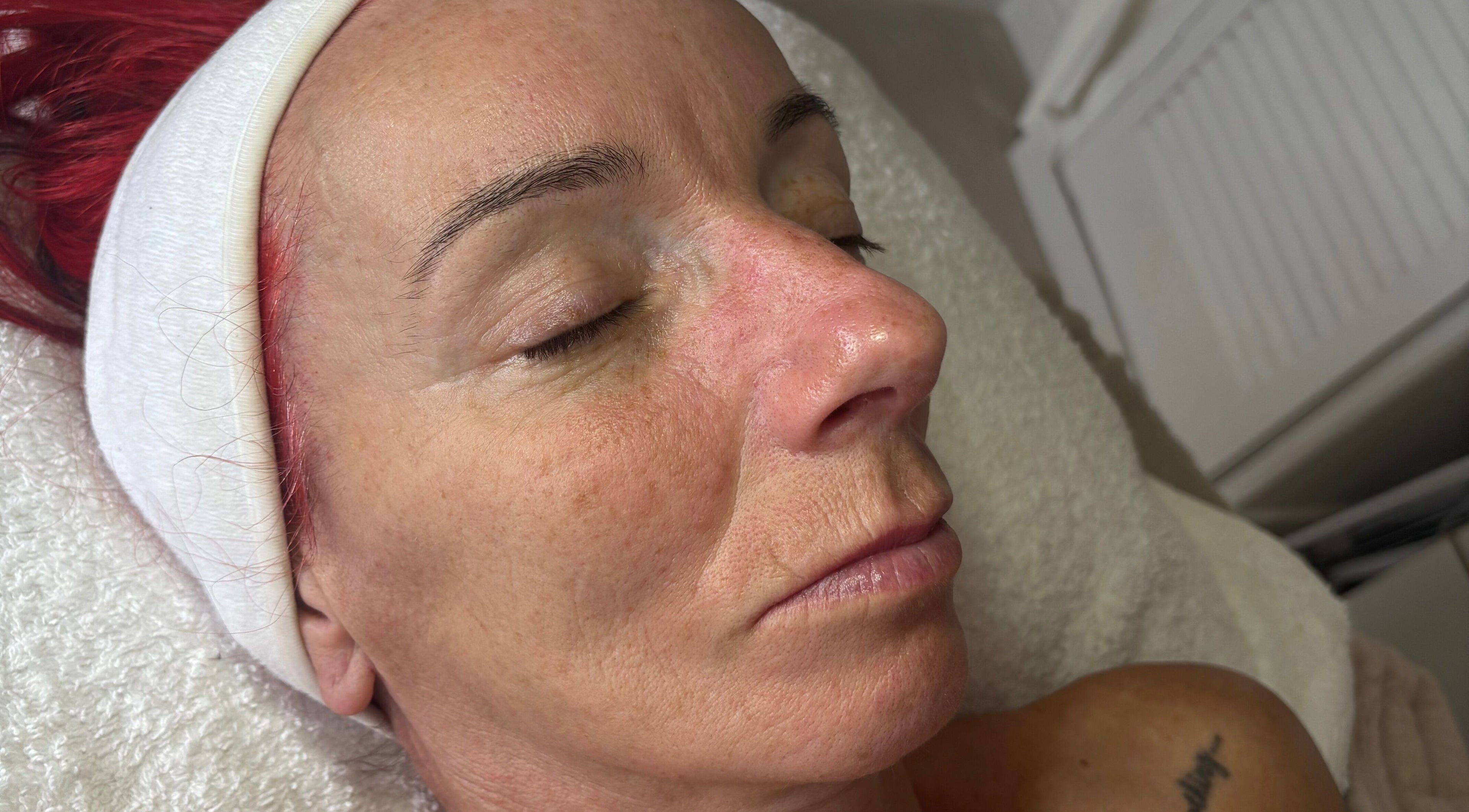 Close-up of a woman receiving facial treatment at Train Your Spirit in Wishaw, Scotland, GB.