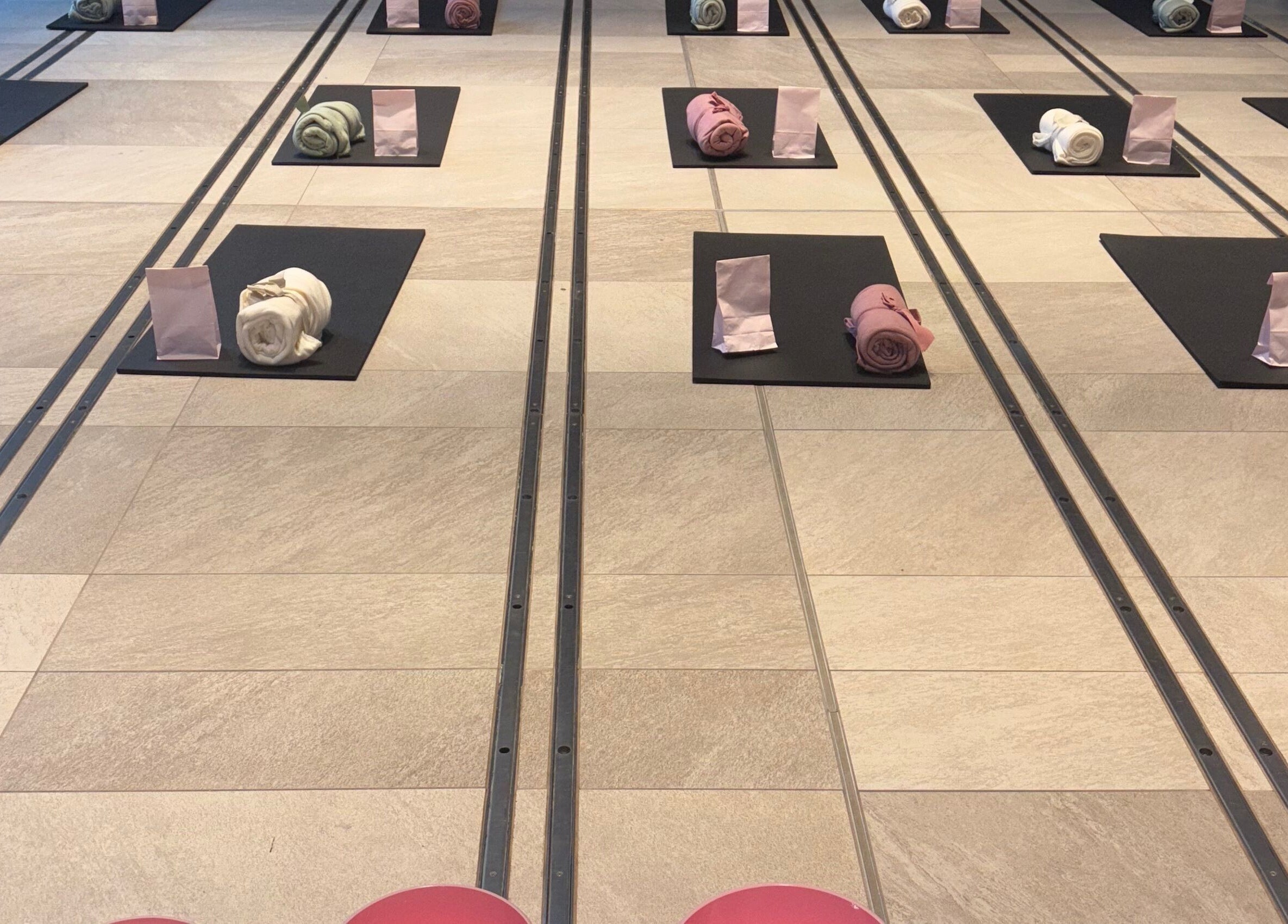 Train Your Spirit yoga setup with mats and towels in Wishaw, Scotland, GB, ready for relaxation.