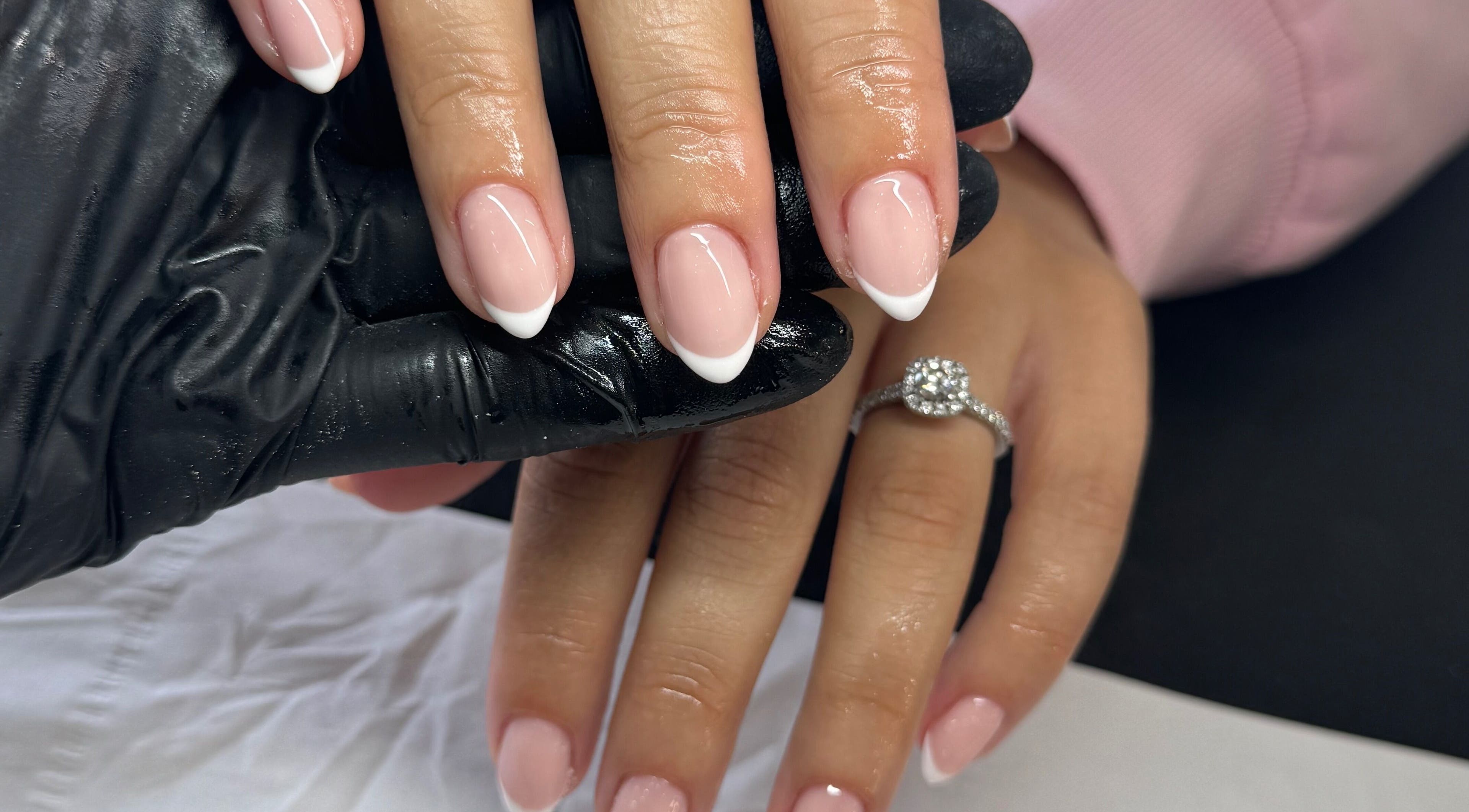 French manicure at Fawcett & Co., Leeds, England, GB showcasing a sparkling ring.