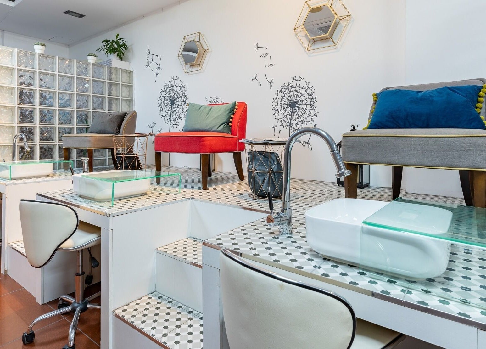 Modern nail stations at Dew Beauty and Wellness, London, England, GB, with chic chairs and decor.