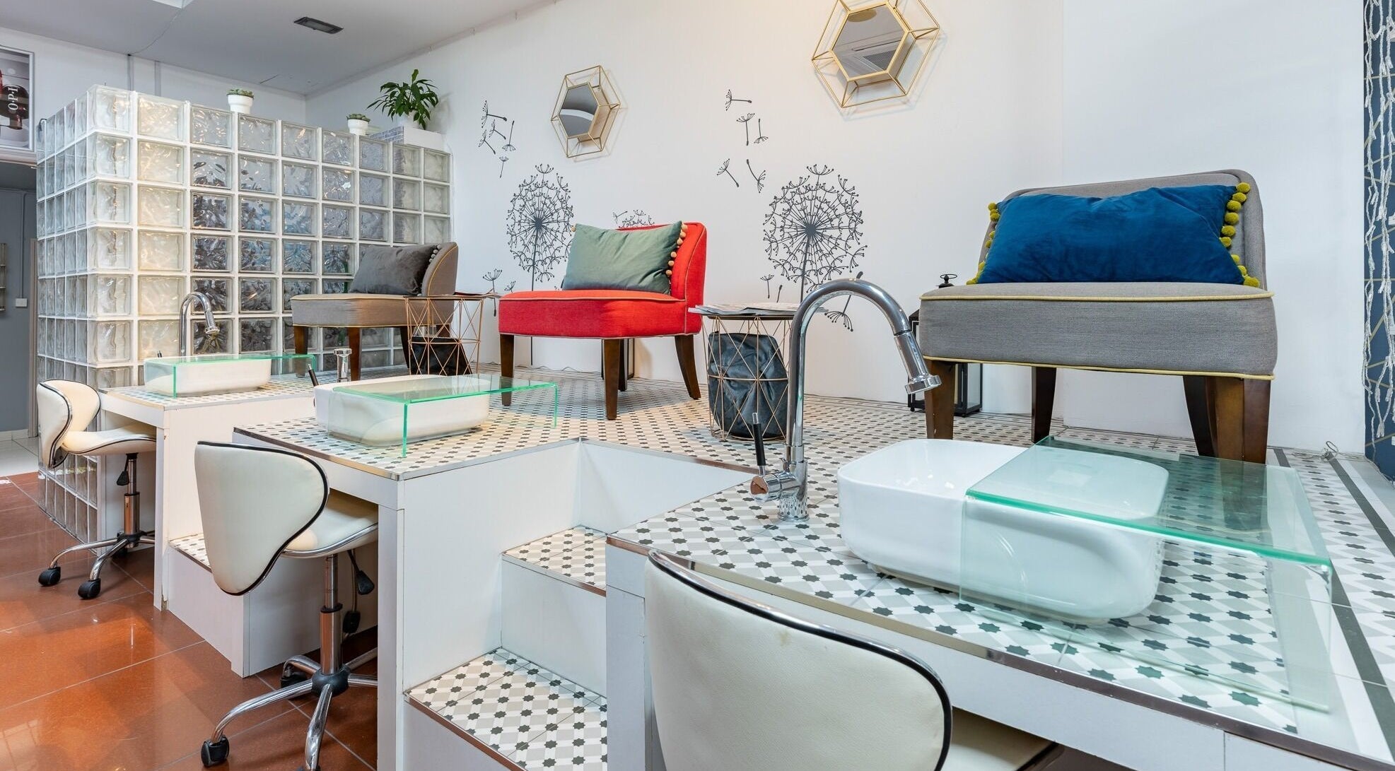 Modern nail stations at Dew Beauty and Wellness, London, England, GB, with chic chairs and decor.