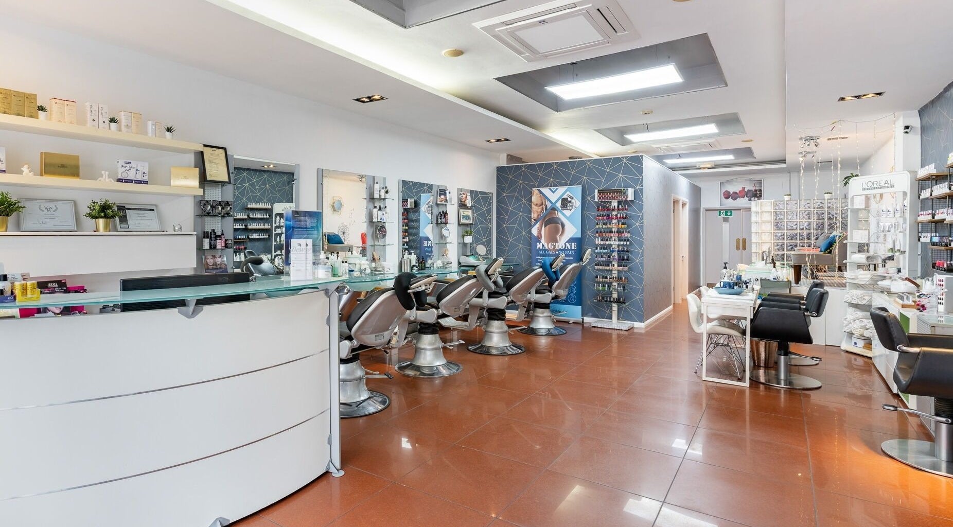 Stylish interior of Dew Beauty and Wellness in London, England, GB showcasing salon chairs and product displays.
