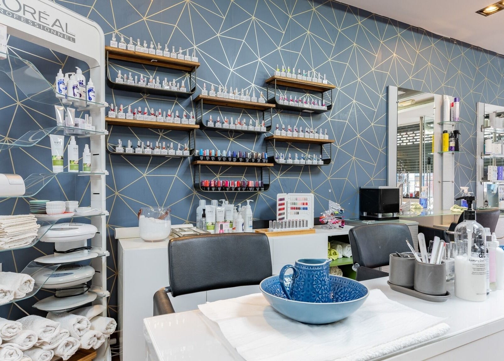 Modern beauty station at Dew Beauty and Wellness, London, England, GB, showcasing luxury products and seating.